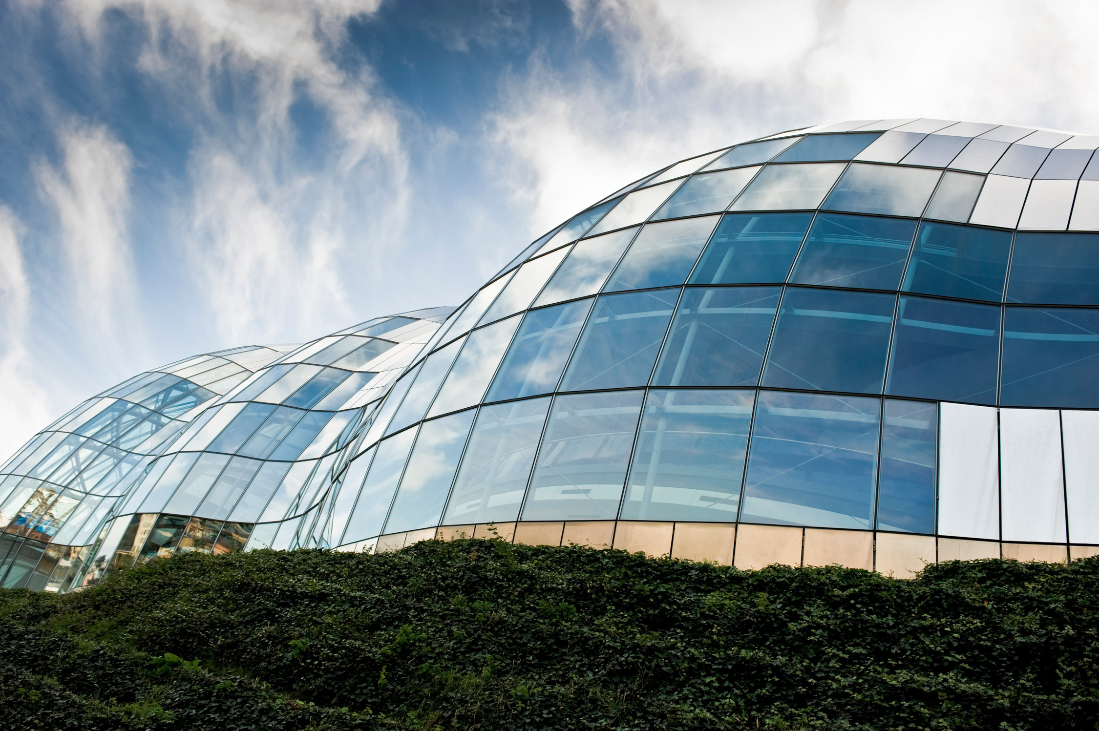 Reflective structure enhancing building shape.