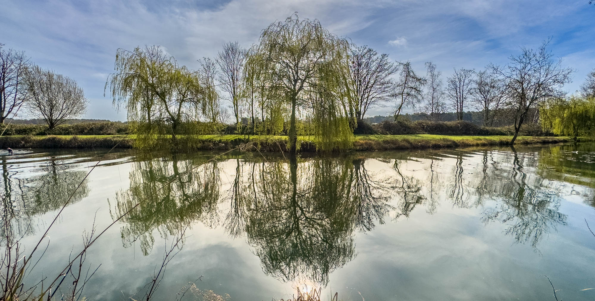 Demonstrating reflections in the still water of a lake.