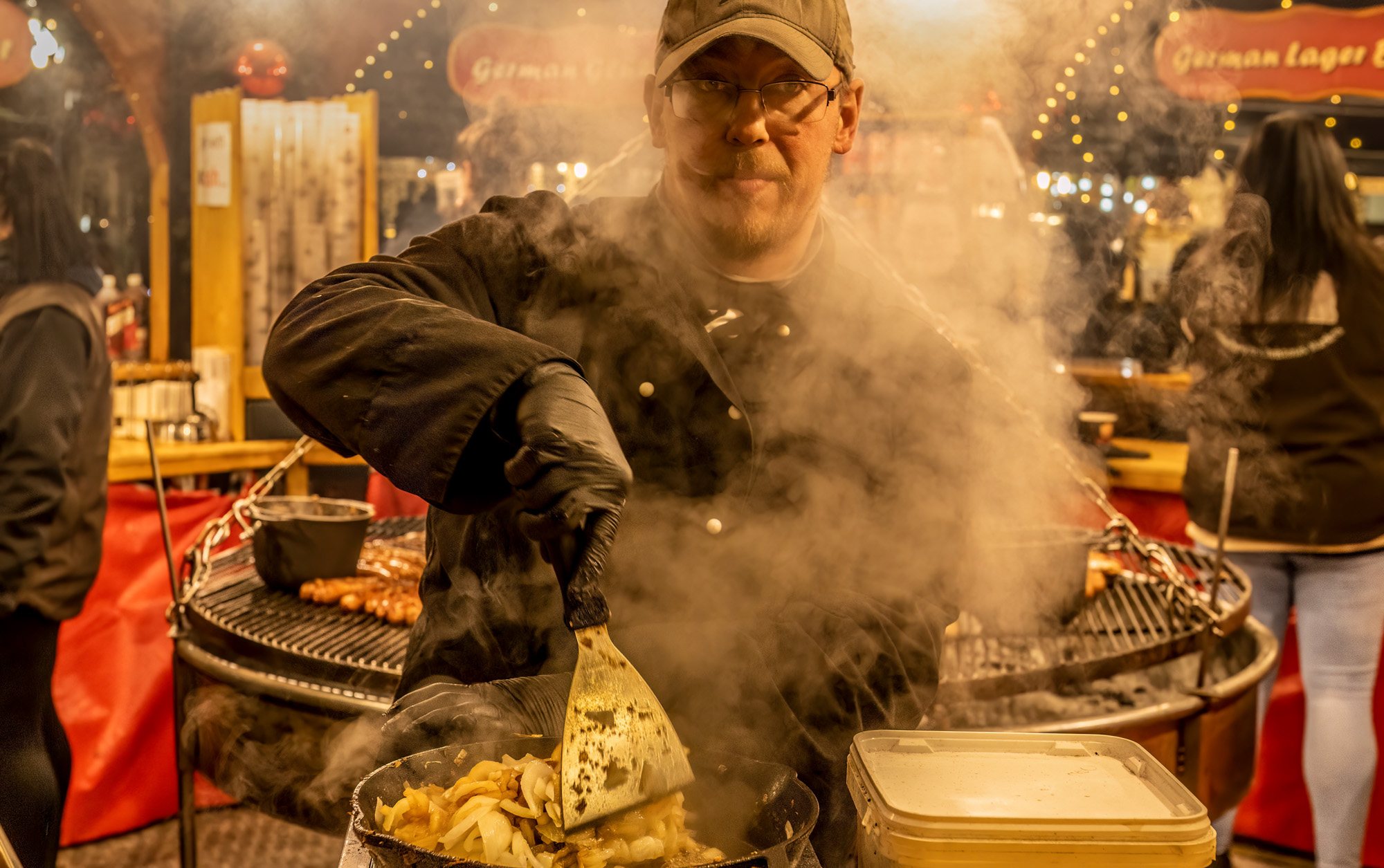 Example of street photography, man preparing street food.